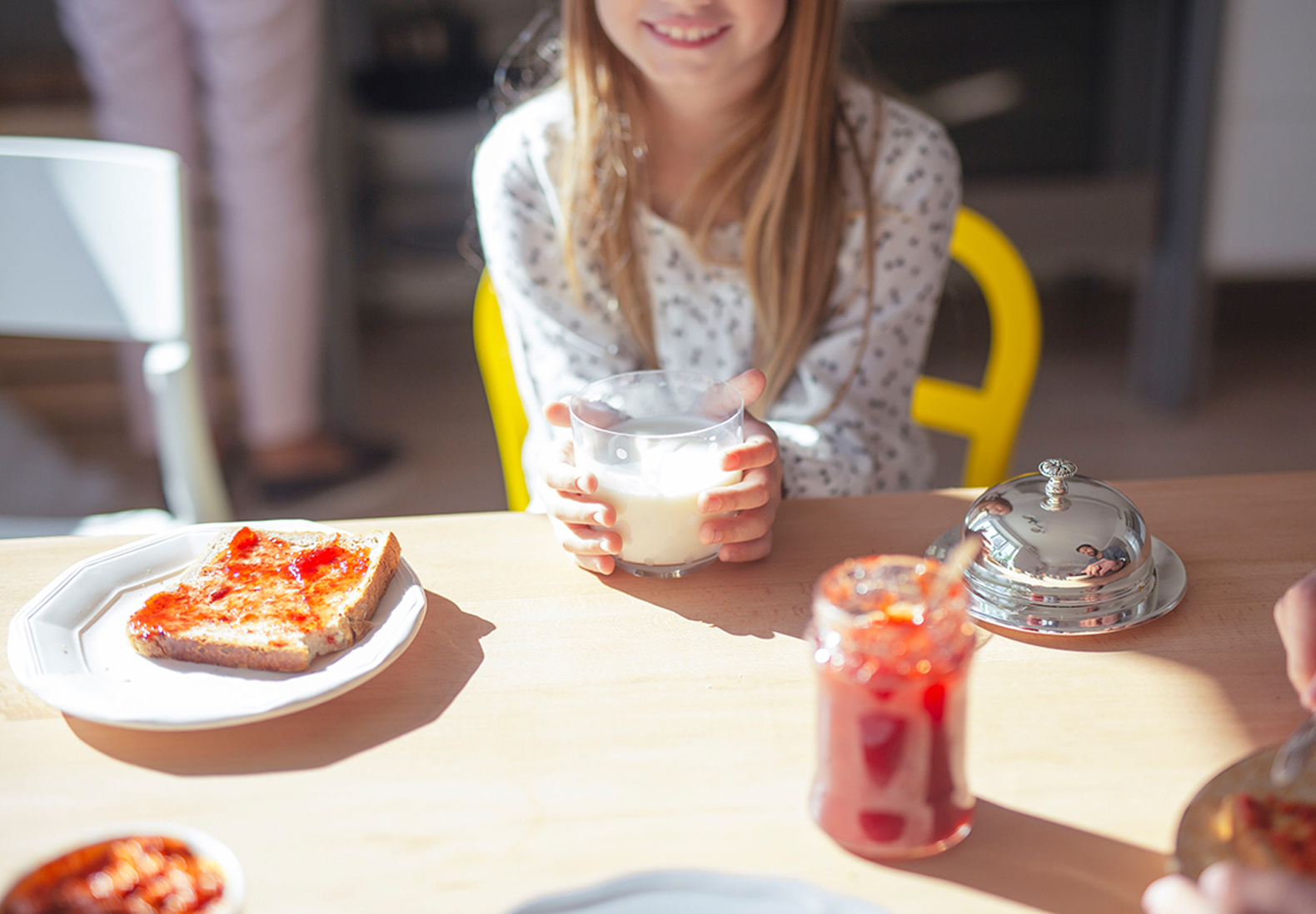 Girl Enjoying Breakfast with Amano Enzyme-Enhanced Plant-Based Milk